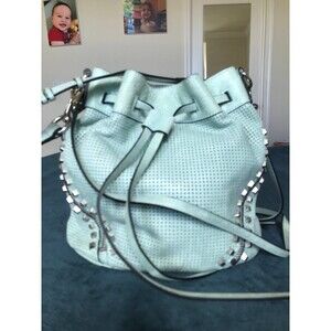 She + LO mint green laser cur perforated moto city bucket bag